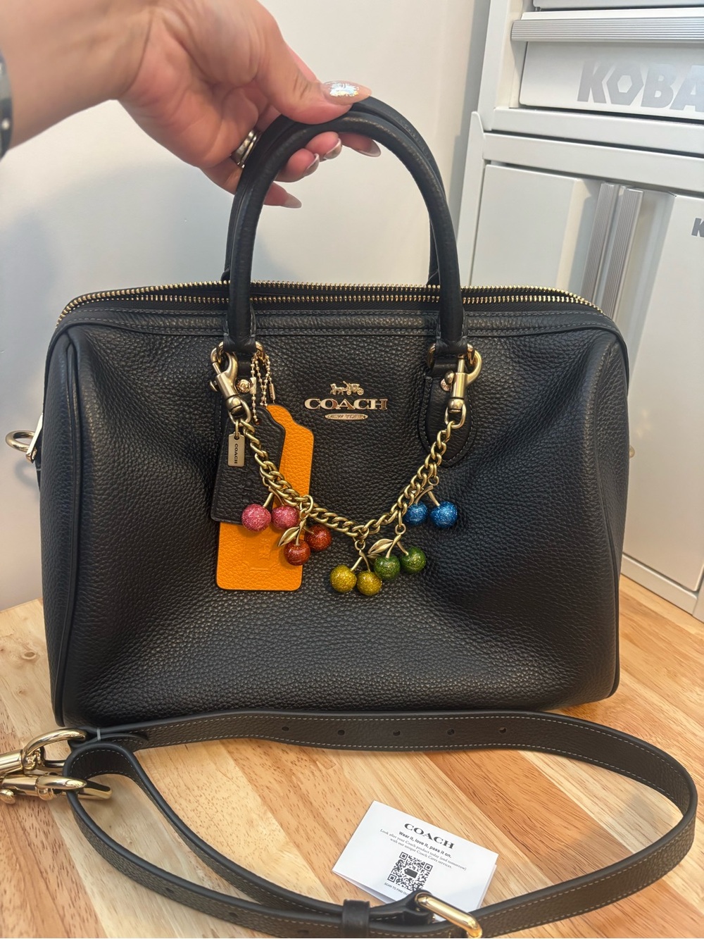 Coach Black Pebbled Leather large rowan with cherries charm